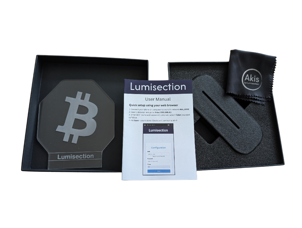 Packaging of Akis standard bitcoin version with user manual and microfiber cloth