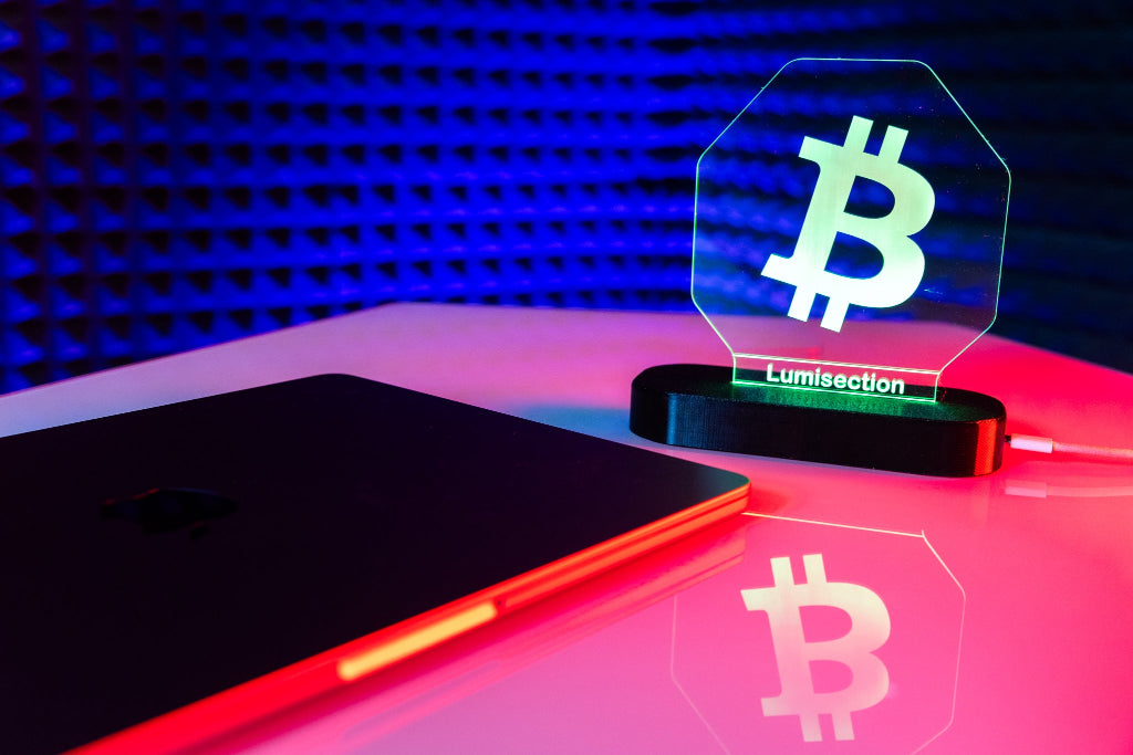 Glowing Bitcoin symbol on a stand with a colorful background