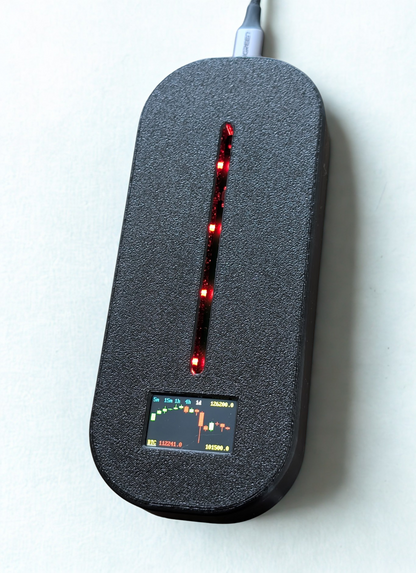 Black electronic device with red lights on a white background